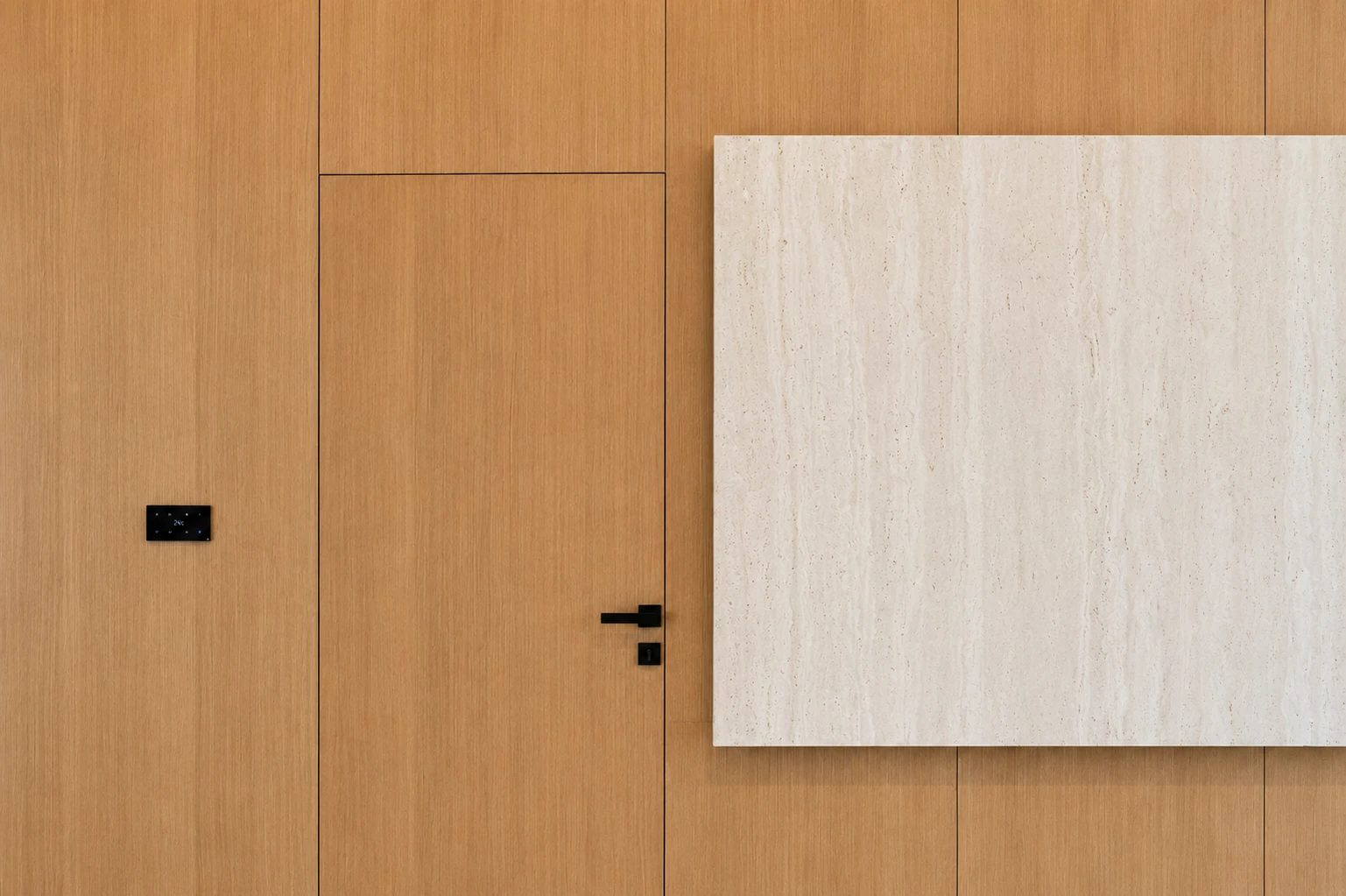Oak joinery with travertine inset